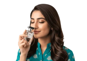 Pakistani woman smelling perfume